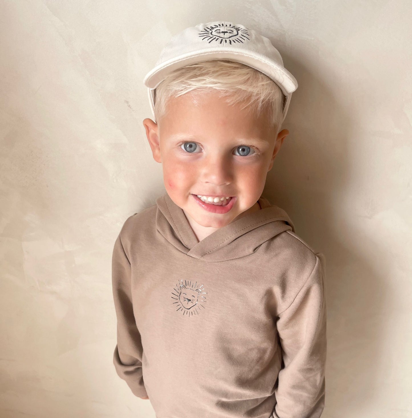 Babykleding - Pet/Cap Lenn Lion logo Beige